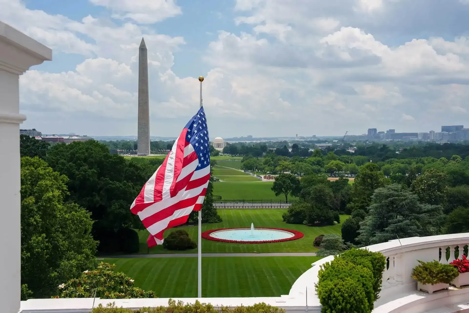 US Flag with the monument in the background
